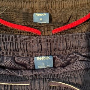 Two pair of men’s Reebok wind pants, like new